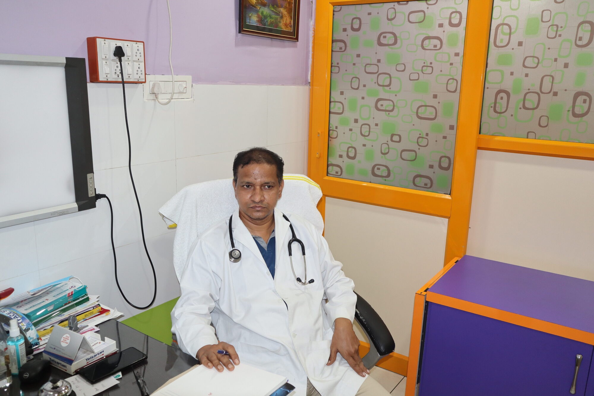 Dr. Venkata Swamy Kolipaka, MBBS, MS (Ortho) in his consultation room at Latha Venkat Ortho & General Care
